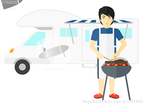 Image of Man preparing barbecue.