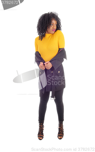 Image of African American woman in yellow sweater.