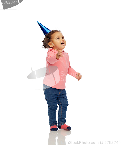 Image of happy little baby girl with birthday party hat