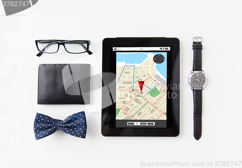 Image of tablet pc with navigator map and personal stuff