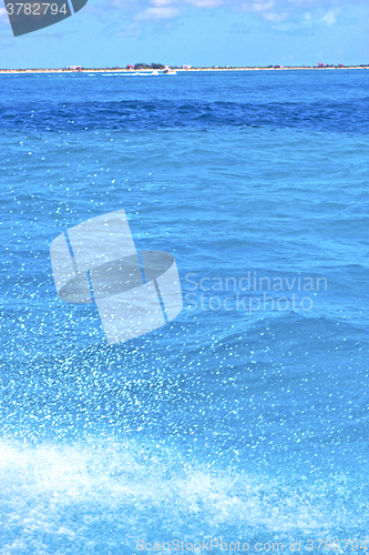 Image of ground wave  in    blue  foam   sea drop sunny day  