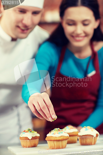 Image of happy woman and chef cook baking in kitchen