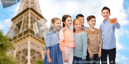 Image of kids talking smartphone selfie over eiffel tower