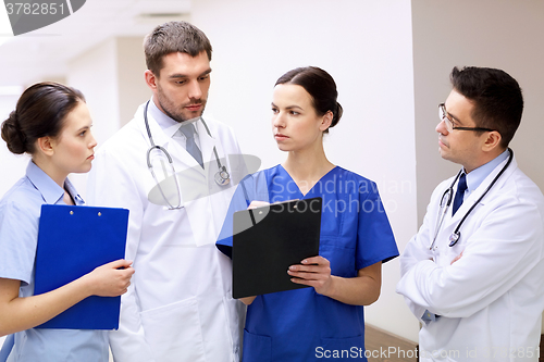 Image of group of medics at hospital with clipboard