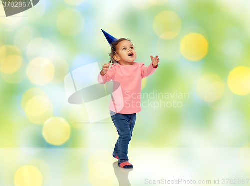 Image of happy little baby girl with birthday party hat