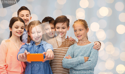 Image of happy children talking selfie by smartphone