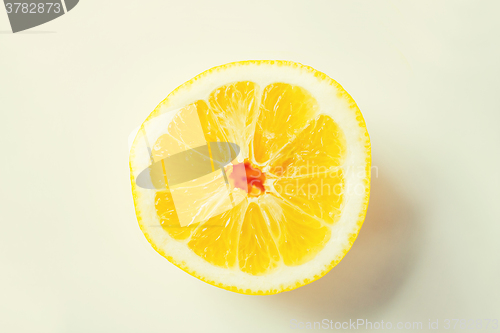 Image of ripe orange or lemon slice over white