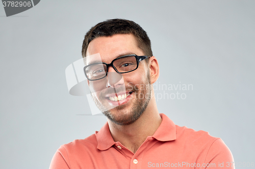 Image of portrait of happy smiling man in eyeglasses