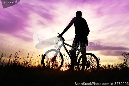 Image of traveler at sunset time