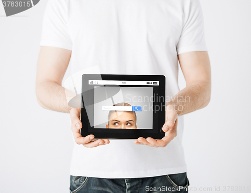 Image of close up of man with web search bar on tablet pc