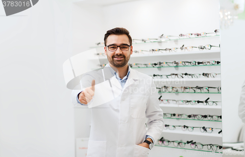 Image of man with glasses and thumbs up at optics store