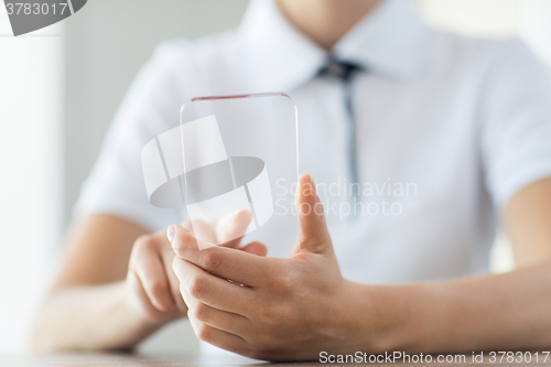 Image of close up of woman with transparent smartphone