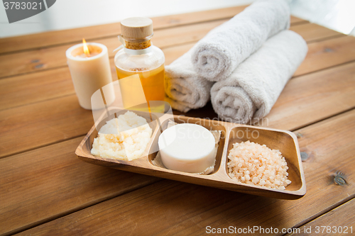 Image of close up of soap, himalayan salt and scrub in bowl