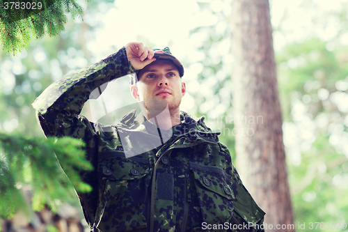 Image of young soldier or ranger in forest