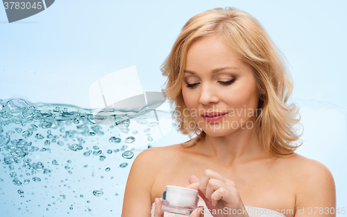 Image of middle aged woman with cream jar