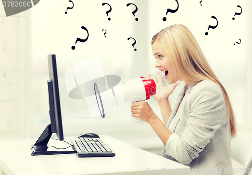 Image of strict businesswoman shouting in megaphone