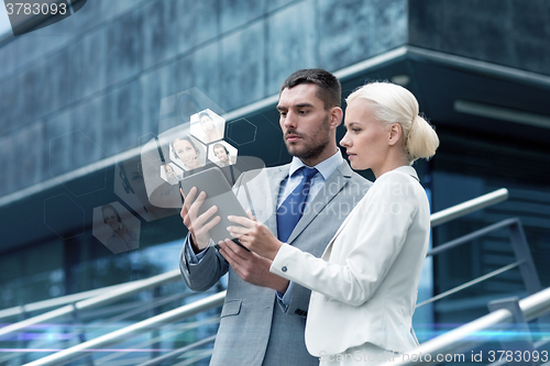 Image of businesspeople with tablet pc outdoors