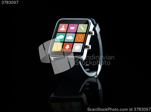 Image of close up of black smart watch with app icons