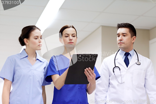 Image of group of medics at hospital with clipboard