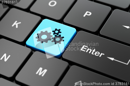 Image of Marketing concept: Gears on computer keyboard background