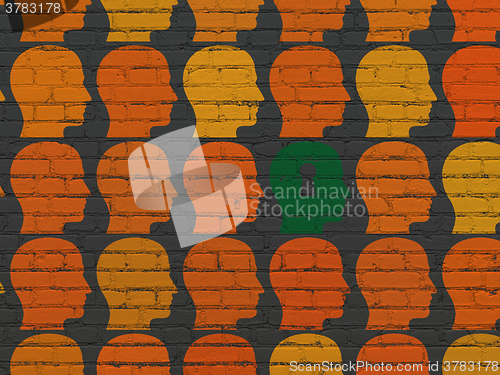 Image of Finance concept: head with keyhole icon on wall background