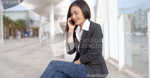 Image of Pretty woman talking on a mobile