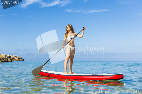 Image of Woman practicing paddle