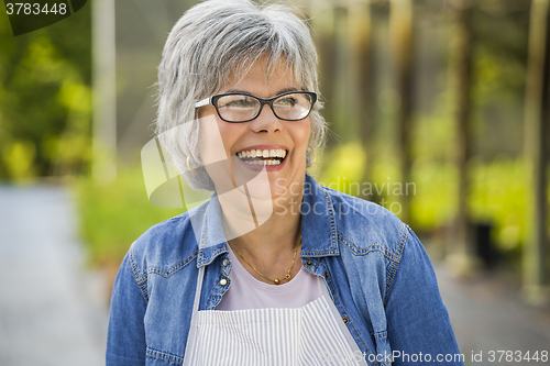 Image of Mature woman laughing