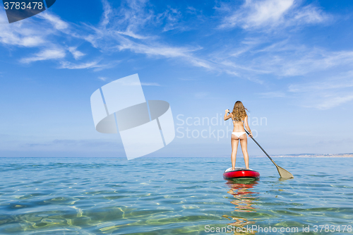 Image of Woman practicing paddle