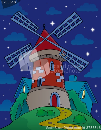 Image of Hill with windmill at night