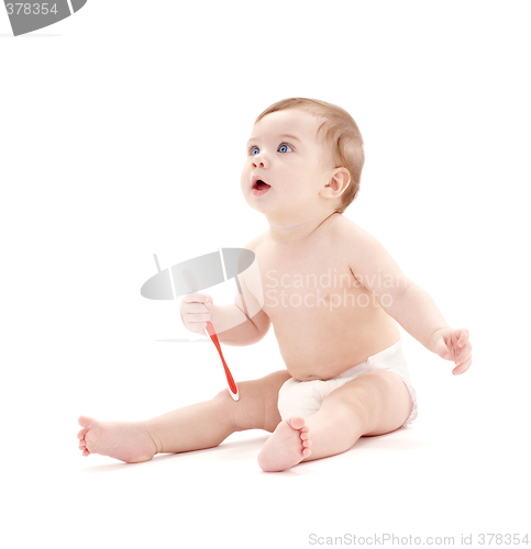 Image of baby boy in diaper with toothbrush #2