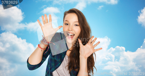 Image of happy laughing pretty teenage girl showing hands