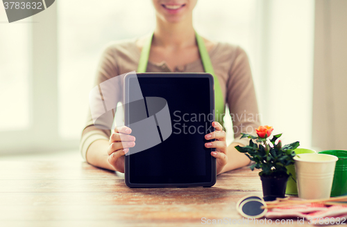 Image of close up of woman or gardener with tablet pc