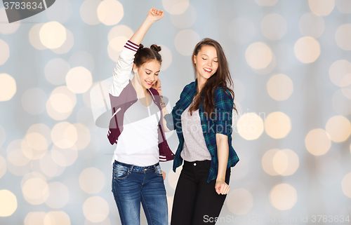 Image of happy smiling pretty teenage girls dancing