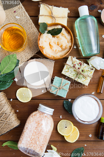 Image of close up of body care cosmetic products on wood