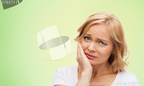 Image of unhappy woman suffering toothache