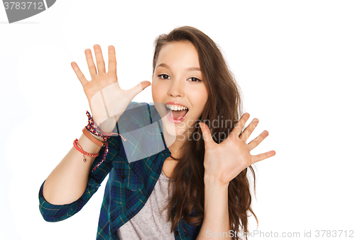 Image of happy laughing pretty teenage girl showing hands