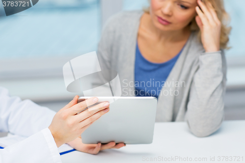 Image of doctor with tablet pc and ill woman at hospital