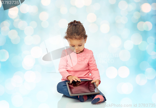 Image of little baby girl playing with tablet pc computer