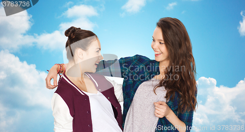 Image of happy smiling pretty teenage girls hugging