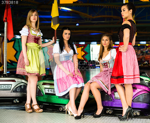 Image of Gorgeous young women at German funfair