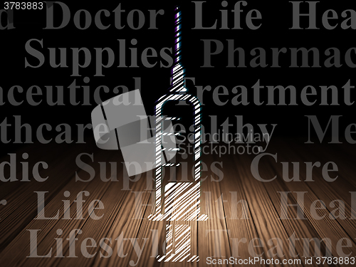 Image of Health concept: Syringe in grunge dark room