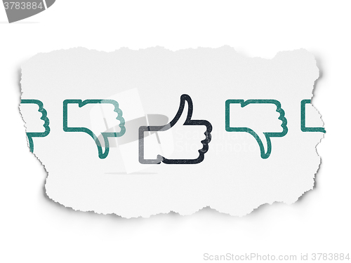 Image of Social network concept: thumb up icon on Torn Paper background