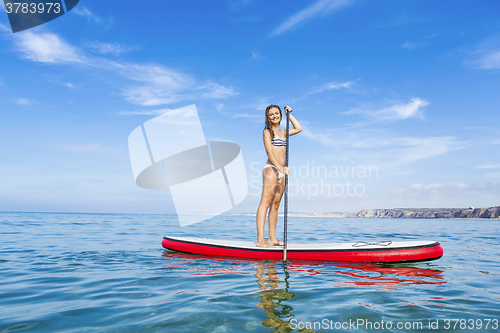 Image of Woman practicing paddle