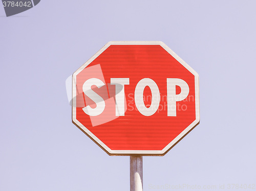 Image of  Stop sign over blue sky vintage