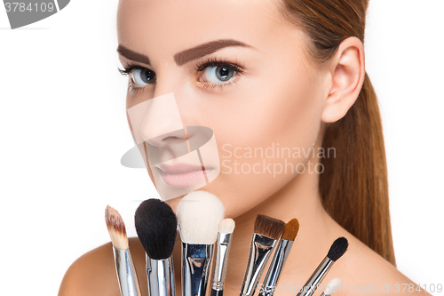 Image of Beautiful female eyes with make-up and brushes