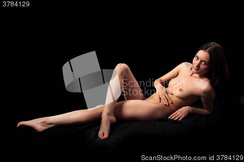 Image of sensual nude woman on black background