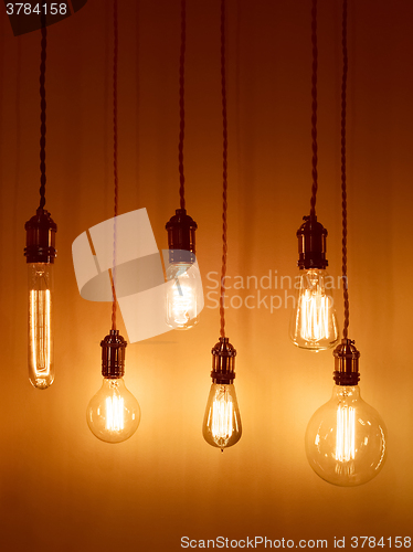 Image of Light bulbs on warm orange background