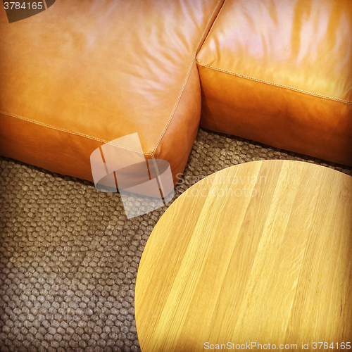 Image of Detail of leather sofa and coffee table