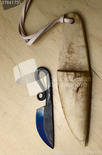 Image of traditional finnish knife puukko and wooden sheath
